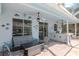 Covered patio with a fire pit, plush seating, an outdoor bar, and screened-in pool at 4063 Ligustrum Dr, Palm Harbor, FL 34685