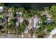 Aerial view showing property lines of the area, surrounded by beautiful trees and waterfront access at 4112 Alafia Blvd, Brandon, FL 33511