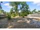 Spacious backyard featuring mature trees and an open yard with plenty of space at 4112 Alafia Blvd, Brandon, FL 33511