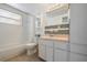 Bright bathroom features decorative mirror, shower and tub, and a tiled floor at 4112 Alafia Blvd, Brandon, FL 33511