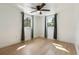 Bright bedroom features laminate flooring, modern ceiling fan, and lots of natural light at 4112 Alafia Blvd, Brandon, FL 33511