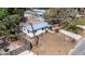 Charming white home with metal roof, fenced yard, driveway, and landscaping at 4112 Alafia Blvd, Brandon, FL 33511