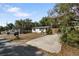 Exterior front view of house with ample parking, mailbox and small garden at 4112 Alafia Blvd, Brandon, FL 33511
