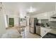 Bright kitchen features stainless appliances, tile backsplash, and an eat-in dining space at 4112 Alafia Blvd, Brandon, FL 33511