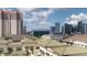 Wide angle view showing the city skyline from above the green tile rooftops at 450 Knights Run Ave # 703, Tampa, FL 33602