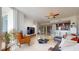 Open-concept living room featuring marble floors, bar and floor-to-ceiling windows at 450 Knights Run Ave # 703, Tampa, FL 33602