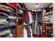 Spacious walk-in closet with custom shelving and ample storage for clothing and shoes at 450 Knights Run Ave # 703, Tampa, FL 33602