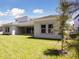 Exterior of home showcasing backyard and patio area, perfect for entertaining at 4517 Foley Grove Dr, Valrico, FL 33596