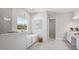 Elegant bathroom featuring a standalone tub, walk-in shower, and stylish fixtures at 4517 Foley Grove Dr, Valrico, FL 33596