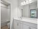 Bright bathroom features a shower-over-tub combo and vanity with modern fixtures at 4517 Foley Grove Dr, Valrico, FL 33596