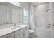 Bright bathroom showcasing a vanity with a shower-tub combo at 4517 Foley Grove Dr, Valrico, FL 33596