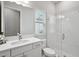 Bright bathroom features a glass-enclosed shower and a white vanity with modern fixtures at 4517 Foley Grove Dr, Valrico, FL 33596