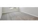 Bedroom featuring neutral carpeting and ample natural light from large windows at 4517 Foley Grove Dr, Valrico, FL 33596