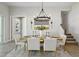 Dining room featuring modern chandelier, natural light and seamless design at 4517 Foley Grove Dr, Valrico, FL 33596