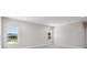 Spacious room with neutral walls, carpet, and natural light pouring in from two windows at 4517 Foley Grove Dr, Valrico, FL 33596