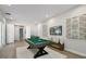 Bright game room offers ample space and features a pool table for leisure and entertainment at 4517 Foley Grove Dr, Valrico, FL 33596