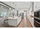 Modern kitchen boasts a large island, stainless steel appliances, and open layout to the living area at 4517 Foley Grove Dr, Valrico, FL 33596