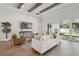 Bright living room boasts an open layout, neutral décor, light wood flooring and natural sunlight at 4517 Foley Grove Dr, Valrico, FL 33596