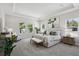 Spacious main bedroom with a tray ceiling, ample natural light, and neutral decor at 4517 Foley Grove Dr, Valrico, FL 33596
