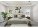 Bright and airy main bedroom with a large bed, plush bedding, and serene ambiance at 4517 Foley Grove Dr, Valrico, FL 33596