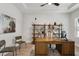 Home office with wood desk, shelving, and natural light at 4517 Foley Grove Dr, Valrico, FL 33596