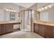 The spacious bathroom features a glass door shower and dual vanity with ample countertop space at 4931 Sevilla Shores Dr, Wimauma, FL 33598