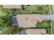 Aerial view of a home with a screened-in pool, showcasing the well-manicured yard and neighborhood at 5132 Pinnacle Dr, Oldsmar, FL 34677