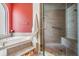 Bathroom showcasing a corner tub and a walk-in shower with a glass door at 5132 Pinnacle Dr, Oldsmar, FL 34677