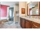 Bathroom featuring a granite-topped vanity and a walk-in shower with a tub at 5132 Pinnacle Dr, Oldsmar, FL 34677