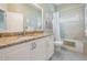 Bathroom featuring a granite vanity and a tiled shower with a tub at 5132 Pinnacle Dr, Oldsmar, FL 34677
