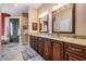 Bathroom featuring a double vanity with granite countertops and a tiled walk-in shower at 5132 Pinnacle Dr, Oldsmar, FL 34677