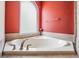 Large bathtub with brushed nickel fixtures and a window for natural light at 5132 Pinnacle Dr, Oldsmar, FL 34677