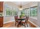 Bright breakfast nook with large windows offering a scenic view of the backyard at 5132 Pinnacle Dr, Oldsmar, FL 34677