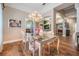 Formal dining room with elegant chandelier and views to the living room and kitchen at 5132 Pinnacle Dr, Oldsmar, FL 34677