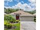 Beautiful single-story home featuring a well-maintained lawn and mature landscaping at 5132 Pinnacle Dr, Oldsmar, FL 34677