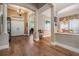 Inviting foyer with hardwood floors, columns and plenty of natural light, leading into the home at 5132 Pinnacle Dr, Oldsmar, FL 34677