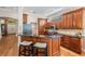 Stylish kitchen with dark wood cabinets, granite countertops, and stainless steel appliances at 5132 Pinnacle Dr, Oldsmar, FL 34677