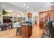 Open concept kitchen with granite countertops, stainless steel appliances, and a breakfast bar at 5132 Pinnacle Dr, Oldsmar, FL 34677