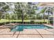 Sparkling screened-in pool and spa with lush golf course views, offering a private outdoor oasis for relaxation at 5132 Pinnacle Dr, Oldsmar, FL 34677