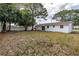 Expansive backyard featuring lush greenery, perfect for outdoor entertaining at 518 62Nd Ne Ave, St Petersburg, FL 33702