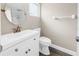 Bathroom featuring vanity with modern faucet, white toilet and updated shower at 518 62Nd Ne Ave, St Petersburg, FL 33702
