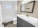 Updated bathroom features sleek vanity, modern fixtures, and tiled shower and tub combo at 518 62Nd Ne Ave, St Petersburg, FL 33702