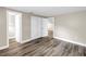 Bedroom featuring modern gray wood-look flooring, neutral paint and closet at 518 62Nd Ne Ave, St Petersburg, FL 33702