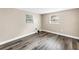 Neutral bedroom with wood look floors and large windows offering plenty of natural light at 518 62Nd Ne Ave, St Petersburg, FL 33702