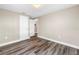 Cozy bedroom featuring wood-look flooring, fresh paint, and neutral decor at 518 62Nd Ne Ave, St Petersburg, FL 33702