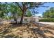 Charming single-story home with stone accents, attached garage, and mature trees enhancing curb appeal at 518 62Nd Ne Ave, St Petersburg, FL 33702