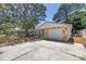Charming single-story home featuring stone accents, garage and concrete driveway at 518 62Nd Ne Ave, St Petersburg, FL 33702