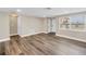 Spacious living room features new wood flooring and a bright, open floor plan at 518 62Nd Ne Ave, St Petersburg, FL 33702