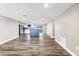 Open concept living space features a large window, recessed lighting, and wood look flooring at 518 62Nd Ne Ave, St Petersburg, FL 33702