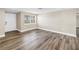 Bright living room with new light-colored paint and wood-look flooring at 518 62Nd Ne Ave, St Petersburg, FL 33702